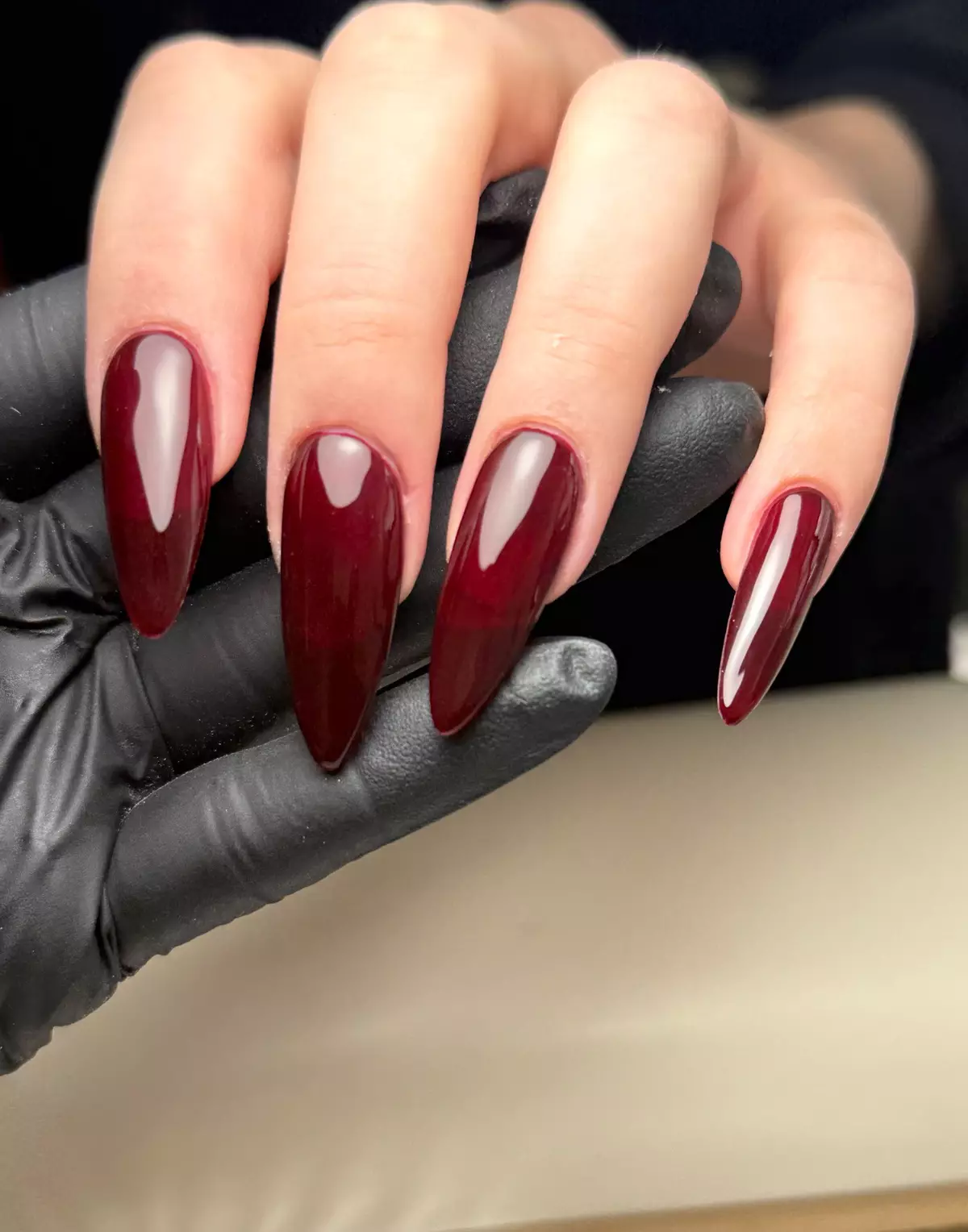 Burgundy stiletto color nails by Nelly Nails NY in East Williamsburg, Brooklyn