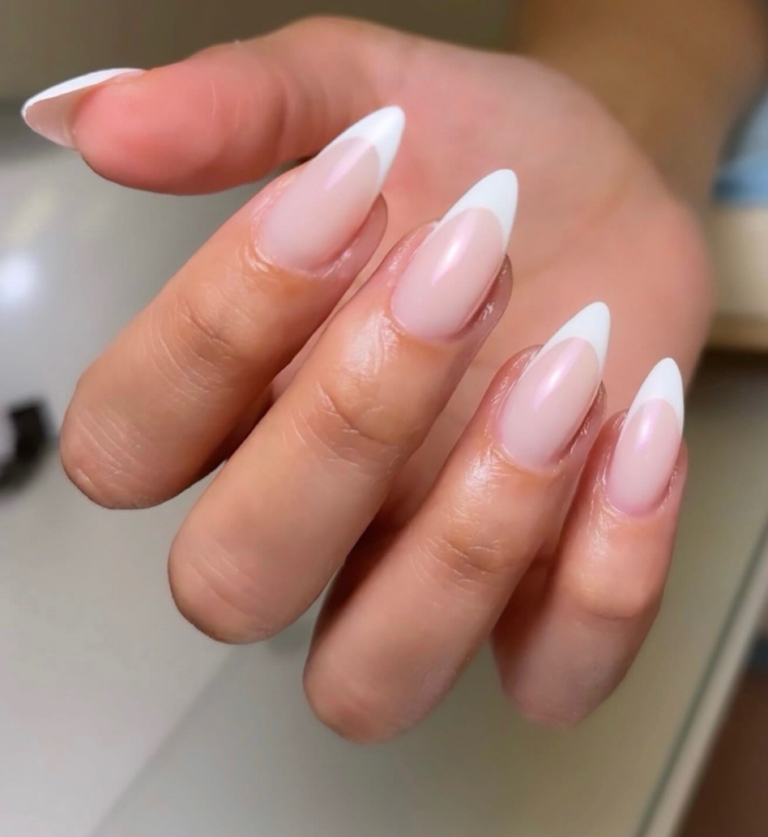 Soft almond french classic nails by Nelly Nails NY in East Williamsburg, Brooklyn