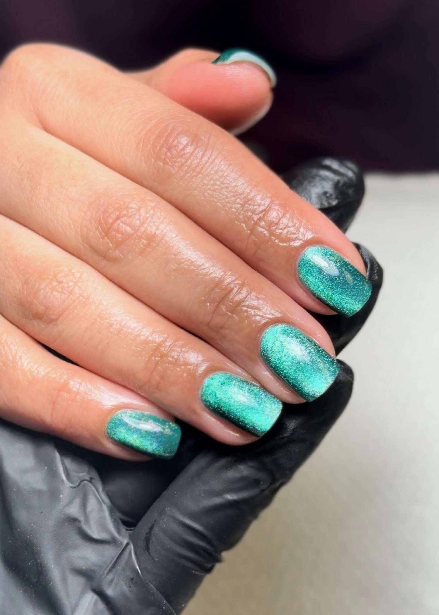 Emerald cat-eye chrome nails by Nelly Nails NY in East Williamsburg, Brooklyn