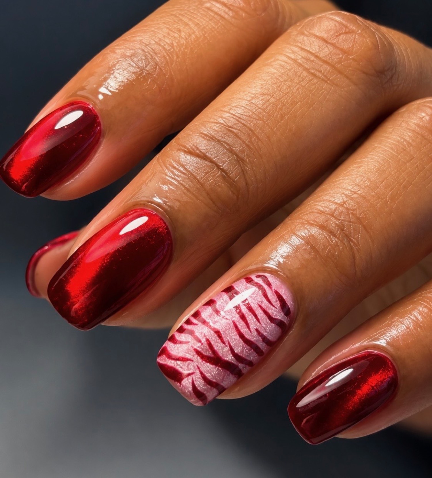 Red cat-eye chrome nails by Nelly Nails NY in East Williamsburg, Brooklyn