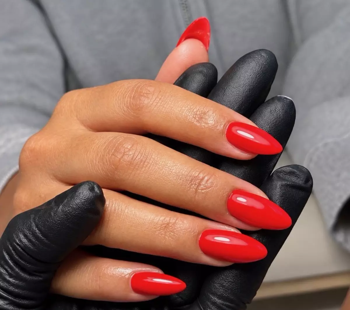 Red almond color nails by Nelly Nails NY in East Williamsburg, Brooklyn